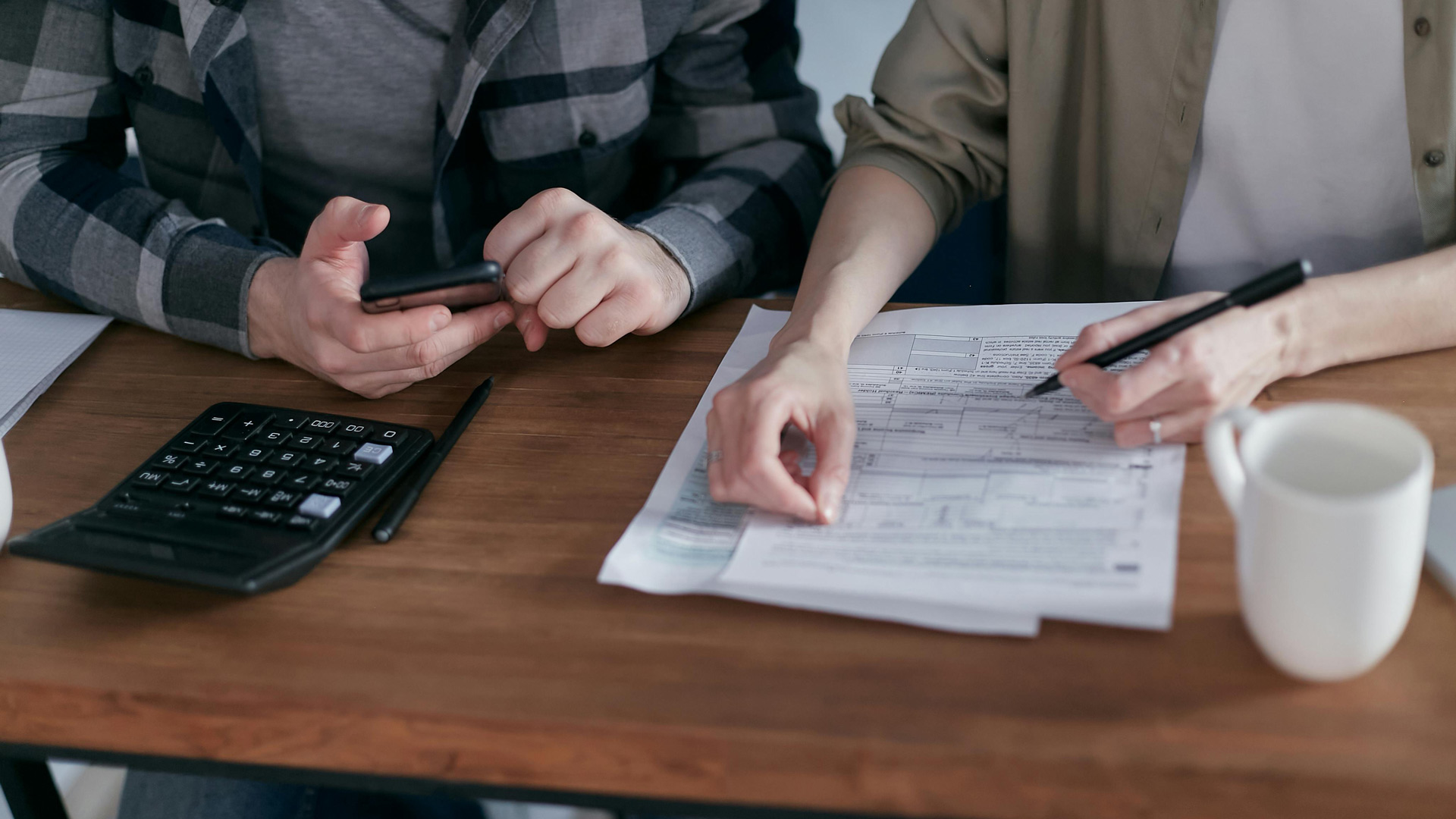 Couple figuring out their Investment Tax Credit for 2025